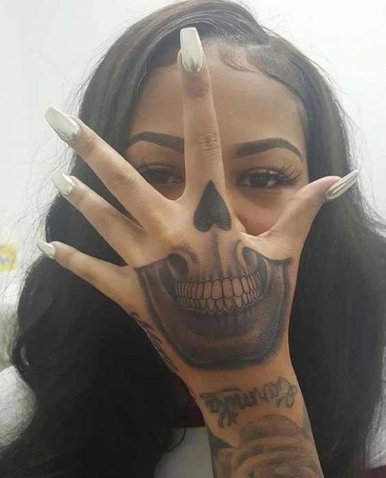 skull hand tattoo