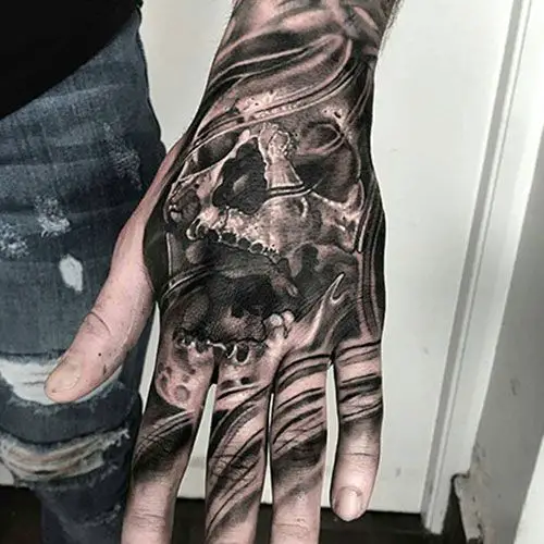 Skull hand tattoo