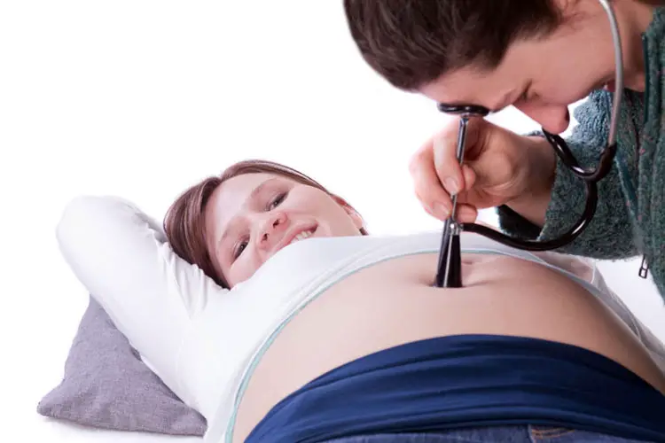 When can you hear baby's heartbeat with a stethoscope